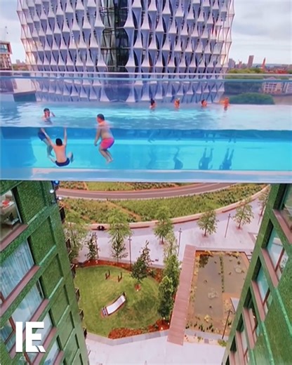 275K views · 1.5K reactions | At Embassy Gardens in London, there's a swimming pool suspended 115 feet in the air. It acts as a clear-bottomed bridge between two buildings. That means swimmers have a bird's eye view of the world below. | Interesting Engineering | Facebook