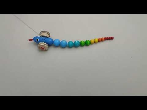 PlanToys Pull Along Snake, a colorful wooden toy designed for young kids