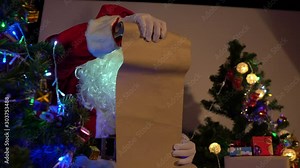 Portrait of santa clause read paper check list name for send gift to children,Thailand people,Xmas festival concept