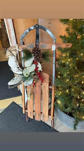 Vintage sleigh with vintage skates ( one left ) Buy the set and I’ll throw in the hanging pinecone greenery for free ! ❄️ Easy porch / entry decor throughout winter . Separate sleigh $29 skates $19 | The Robin's Nest