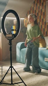 Girl turning on record on phone, creating content for social network in mobile app, dancing and singing, amusing followers, forcing personal channel, creating trend video.