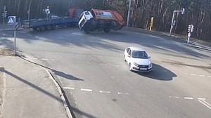 Garbage truck overturns after collision at intersection in Minsk, Belarus