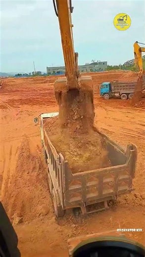 Excavators Load Soil Onto Trucks