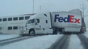 Train crashes into FedEx truck