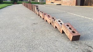 The Double Domino Effect Demonstrated With a Row of Bricks That Fall Perfectly Into Place
