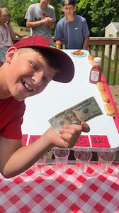 1.2M views · 10K reactions | Hotdog roll challenge -- for $500  Kids and family play cookout table game where they roll hotdogs into cups for money prizes. Perfect diy game for barbecues, picnics, and summer parties. This video was produced by Benson Family, Network Media, and Benson Bros. (for entertainment purposes only) | Aaron’s Family | Facebook