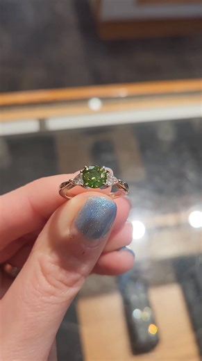 Just in time for Christmas, this stunning ring has arrived! Set in 14K gold it features a 1.15 carat green diamond and .27 carat total weight in colorless diamond. It is a size 6 and the retail price is $4,787. Call, message us, or stop by and see us in Salisbury today! | James Fine Jewelry - Formerly GB Heron
