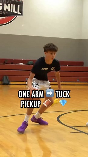 Master the one arm tuck pickup 🏈🔥 follow me for more daily basketball tips like this! Repost this and DM me the word TRANSFORM and I’ll send you 10 drills from our ball handling program! | Danny Cooper