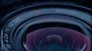 the lens of a movie camera or photo camera is shot in close-up