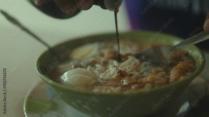 Batchoy, A Filipino Delicacy Being Mixed and Ready to Eat.