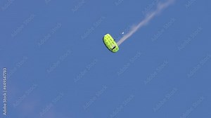 Paragliding flying show with smoke at Gold Coast Pacific Airshow in QLD, Australia.