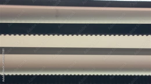 The motorized camera slider driver powers on and initiates movement. This electronic action creates a thin, high-pitched mechanical whine from the internal engine as it coordinates the slide.