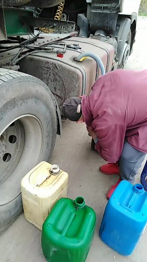 Refueling a Truck with Portable Fuel Containers