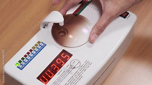 Ultraviolet light transmission tester. Examination in a modern ophthalmological clinic. The optometrist checks the lens. Close-up