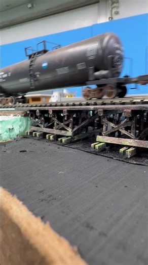 Running across my scratch built, trestle bridge. Details to come.