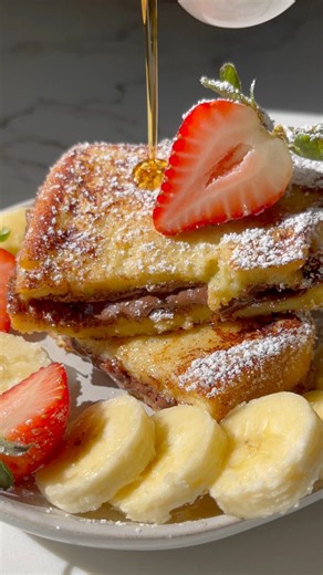1.6M views · 17K reactions | French toast stuffed with Nutella. French toast mix made with eggs, milk, cinnamon, and tiny pinch of salt. Toasted until golden, sprinkled with powdered sugar, drizzle of syrup and paired with fresh fruits #easyrecipe #frenchToast #breakfastideas #sweetbreakfast #easybreakfast #yummyfoodreels | Feed Annna | Facebook