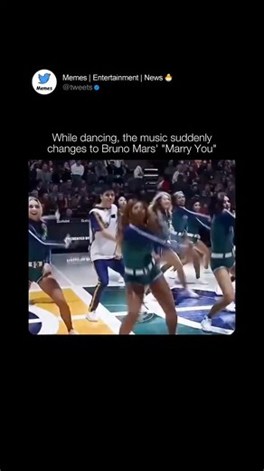 Tweets on Instagram: "At halftime of an NBA game, a cheerleader experienced the surprise of a lifetime. As the squad performed, the music suddenly shifted to Bruno Mars’ Marry You, and the dancers seamlessly transitioned—except for one, who kept going with the original routine, unaware of what was unfolding. From behind her, a man appeared, dropped to one knee, and held out a ring, transforming the performance into a heartfelt proposal in front of the entire arena. A dream moment captured in rea