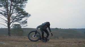 Free stock video - Male cyclist braking and having an accident, falling off the bike in the countryside