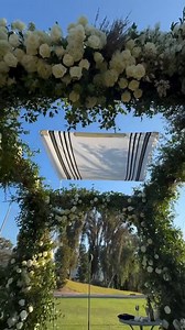This elegant outdoor wedding setup is absolutely stunning, with beautiful floral arrangements and a breathtaking view!  Florals: @hiddengardenflowers Photographer Credit: Olivia Rae James Weddings Videographer Credit: Hoo Films #insideweddings #outdoorwedding #tentedwedding #floraldecor #luxurywedding #weddinginspo #elegantwedding #weddingceremony #weddingdetails #romanticwedding | Inside Weddings | Facebook