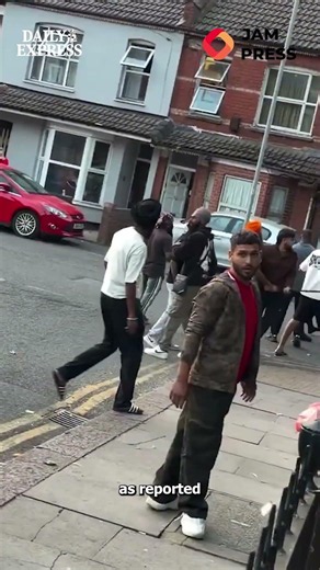 Mass brawl spills out into street as men hit each other with spades and bats 😱 #news #viral