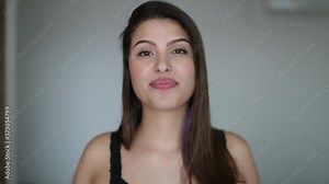 Attractive young woman portrait face real life smile and laugh, pretty girl talking to camera
