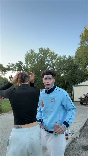 Wyezy shows off his merch w/ fiance Britt.sober