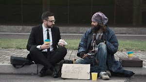 Businessman with homeless on the street - Free Stock Video