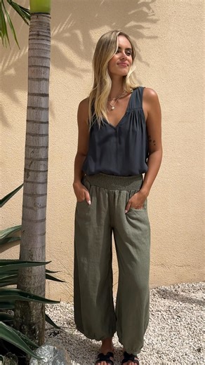 The pants that have earned over 1,000 five-star reviews from real women are finally restocked. Thoughtfully designed with an elasticated, smocked waistband that adapts to your body throughout the day. The relaxed fit moves with you while maintaining its shape, wash after wash. Available in carefully curated earthy tones that complement any wardrobe. Each pair is crafted for women who value both comfort and quality in their everyday wear. These aren't just pants. They're the piece you'll reach fo
