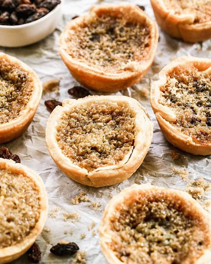 RECIPE: https://www.wellplated.com/butter-tarts/ Baked in a muffin tin, this Canadian butter tarts recipe is sweet and gooey with an indulgent brown sugar and raisin (or walnut) filling. | Well Plated