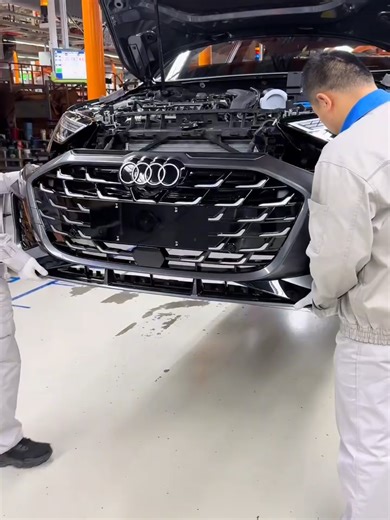 Car factory: front bumper installation