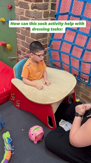 Our Occupational Therapist Maria and Pasquale working together on a fun sock activity to boost bi-manual skills, hand-eye coordination, and hand strength! 💪🌈 Every task brings Pasquale closer to mastering dressing skills with confidence! 😊✨ #therapiesforkids #kidstherapy #occupationaltherapy #physiotherapy #speechpathology #innerwestsydney #ndis #intensivetherapy #innerwestsydney | Therapies For Kids