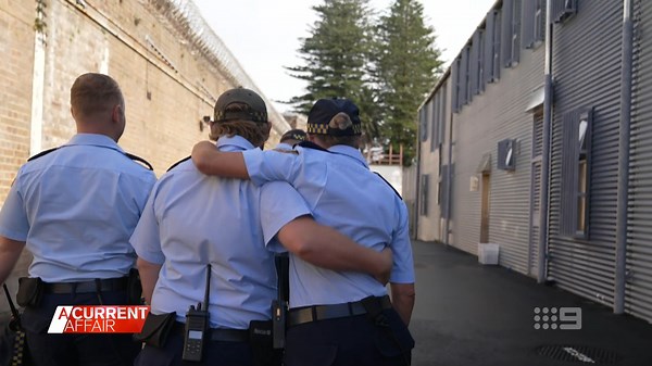 The happy family working behind bars at a notorious Sydney jail