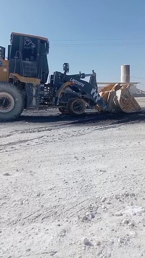 Heavy-Duty Front Loader in Action at Construction Site