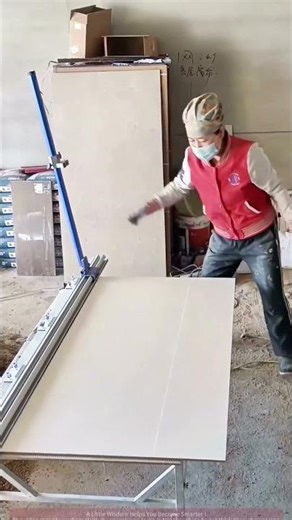 Large tile cutting demonstration, workers skillfully operating the cutting machine