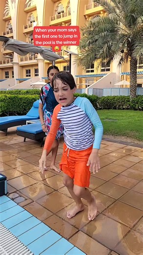 Exciting Pool Jumping Challenge with Mom and Son