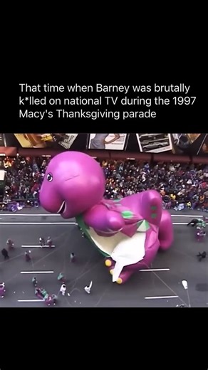 CashFlowClips on Instagram: "The 1997 Macy’s Thanksgiving Day Parade gave Barney one of the most infamous moments in parade history, when powerful winds slammed the giant purple dinosaur balloon into a lamppost, tearing it open and forcing handlers to bring it down in the middle of the street. As the fabric ripped and the balloon deflated, police and parade volunteers had to pile on top of it to stop it from blowing away, shocking the crowd and instantly turning the collapse into a legendary pie