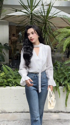 444 reactions · 24 shares | The slim-striped blouse brings a touch of timeless elegance, paired with classic denim to create an effortlessly chic autumn outfit. The soft lines and subtle contrasts evoke a refined yet relaxed charm — perfect for those crisp, gentle days of fall.  | Gyo Made | Facebook