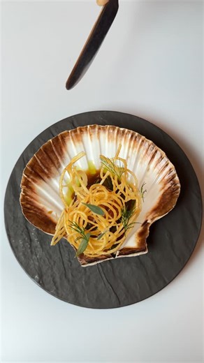 Karhan Tepedelen on Instagram: "Scallop dish I made for my menu couple years back Scallop pan seared , samphire cooked in fumet , touch of lemon juice and butter. Sauced with a rich chicken Demi and finished with dill oil, a light potato nest tuille topped with lemon gel pearls sea purslane and dill"