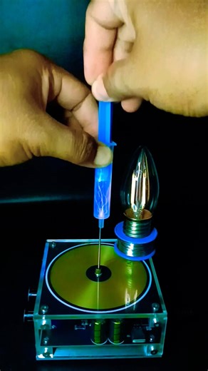 Tesla Coil ⚡ + Syringe 💉 + Light bulb 💡 #teslacoil #experiment #highvoltage