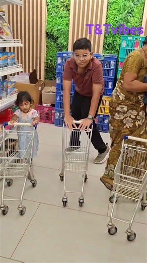 sitting in cart..😄enjoying shopping with karthik anna #twins #shopping #trolley #shorts #fun