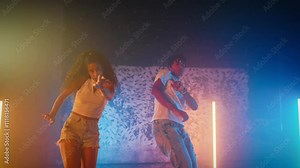 Young black male and female dancers expressing emotions and feelings by dance. Enjoy music and dance, African American people performing traditional and contemporary choreography, slow motion shot