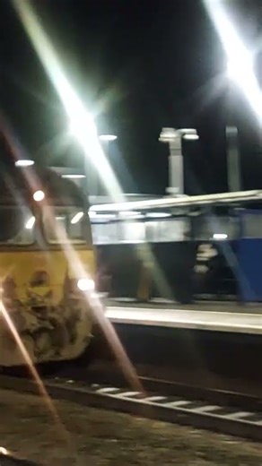 EWS Red & Gold and DB Red Class 66 locomotives pass through Warwick