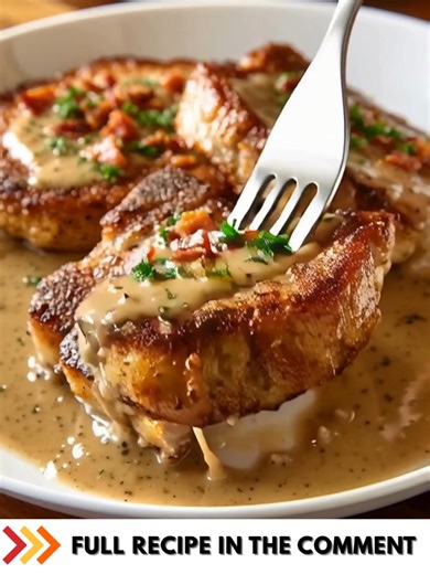 Country Fried Pork Chops with Bacon Gravy Crispy, golden-brown fried pork chops smothered in a rich and creamy bacon gravy—pure Southern comfort food! Ingredients: 4 bone-in pork chops 1 cup buttermilk 1 cup all-purpose flour 1 tsp salt ................. Fυll ᖇecίpe in Coʍmеոτ 💬 | Cook By Book