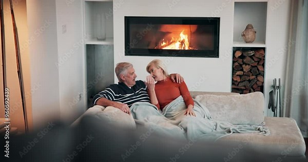 Love, relax and cuddle with old couple on sofa for romance, retirement and marriage milestone. Happiness, calm and commitment with senior man and woman in living room of home for peace and trust