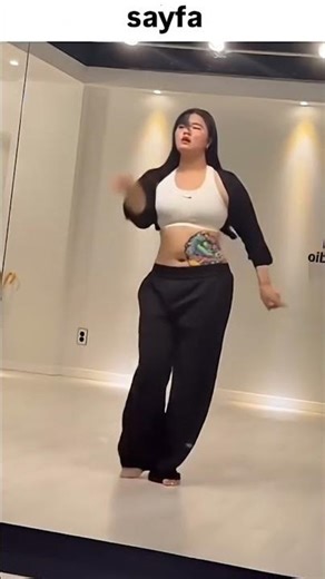 crazy belly tattoo on her belly