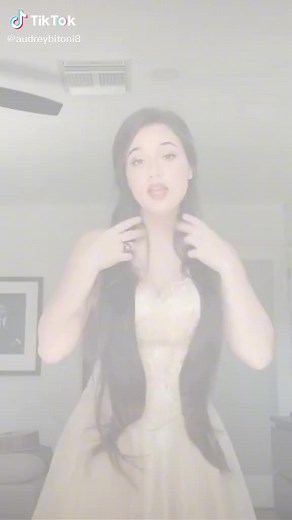 Elegant Lace Gown Presentation with Long Hair Styling