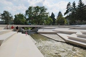 enota's reorganized pedestrian zone in slovenia includes a riverside amphitheater