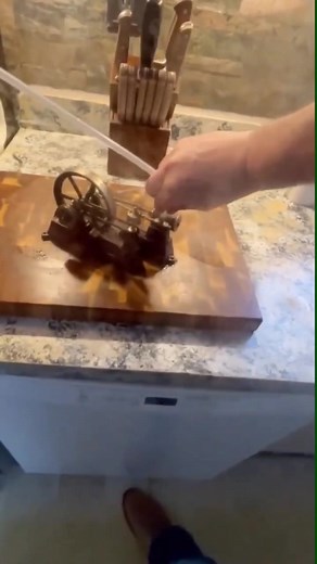 Vintage Steam Engine Operation in a Kitchen Setting