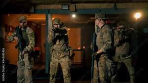 at a professional shooting range military trainers perform tactical exercises with NATO assault rifles