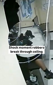Shock moment robbers break through ceiling | The US Sun - News